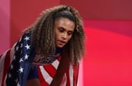 Sydney McLaughlin-Levrone with the United States flag during the 4x400m relays during the Tokyo quadrennial games (Image via: Getty Images)